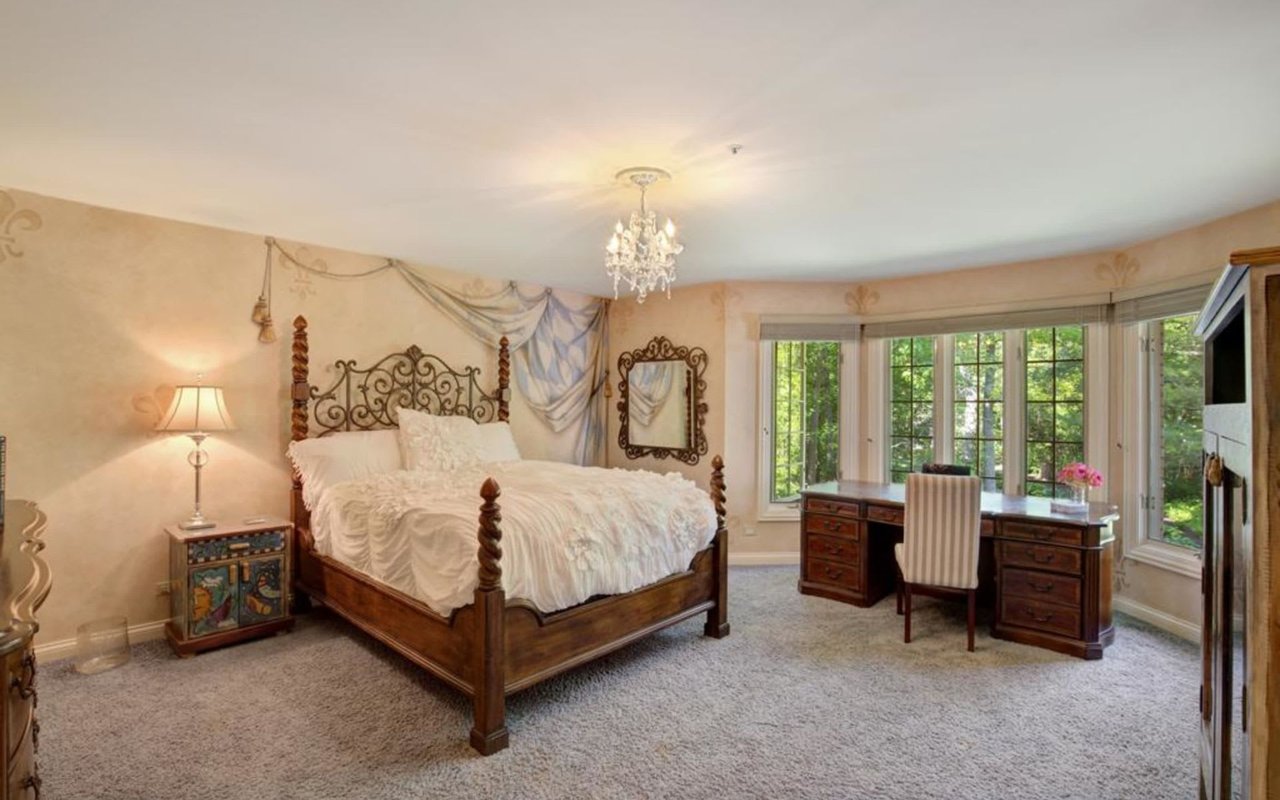 This Stately Brick Traditional Home Is Uniquely Positioned On One Of The Most Private Lots In Royal Melbourne