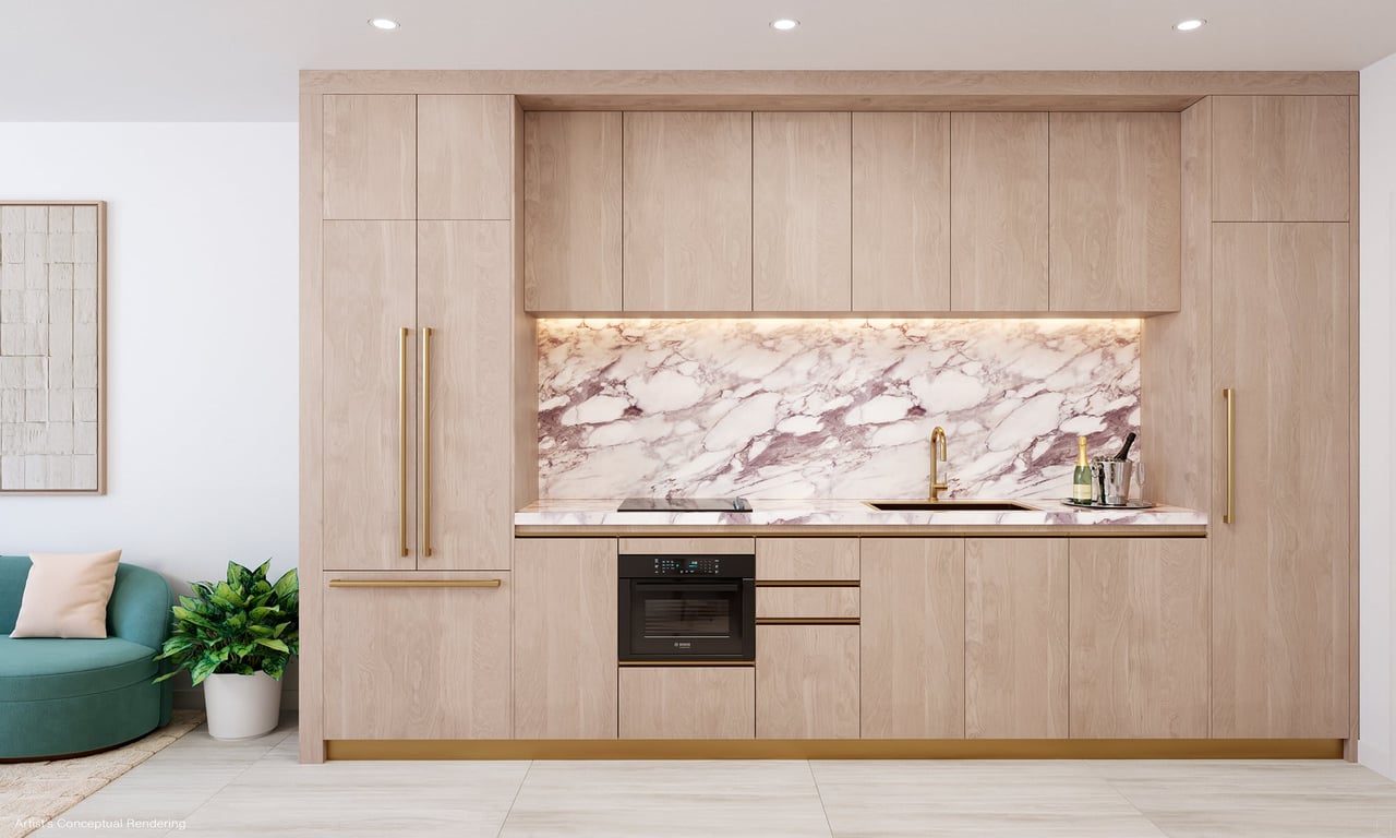 Modern kitchen with light wood cabinetry, a dramatic marble backsplash, and gold-toned fixtures.