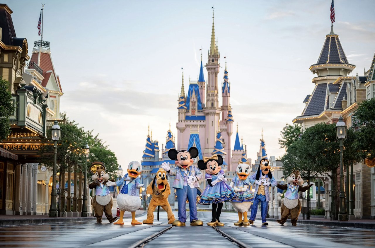 Mickey Mouse and friends on an empty Main St at Disney's Magic Kingdom with the castle in the background