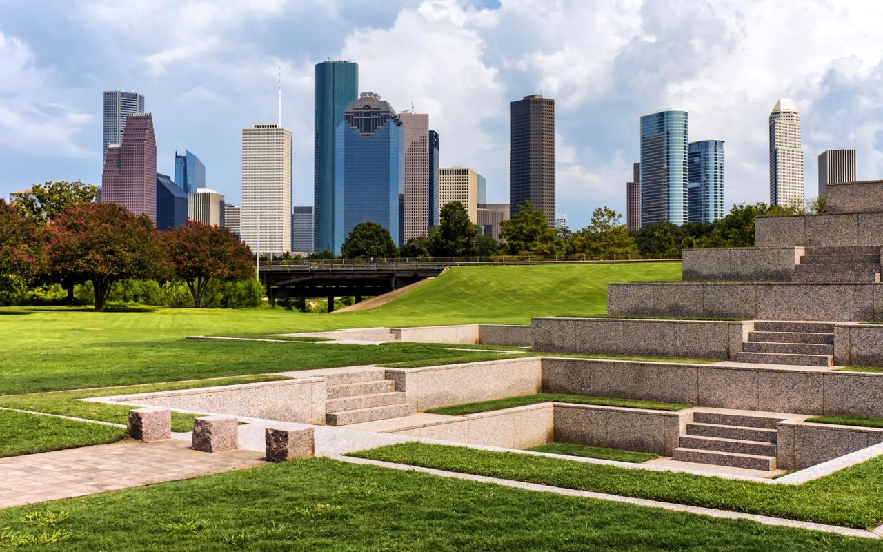  A park with stairs and a city skyline in the background in Memorial Park