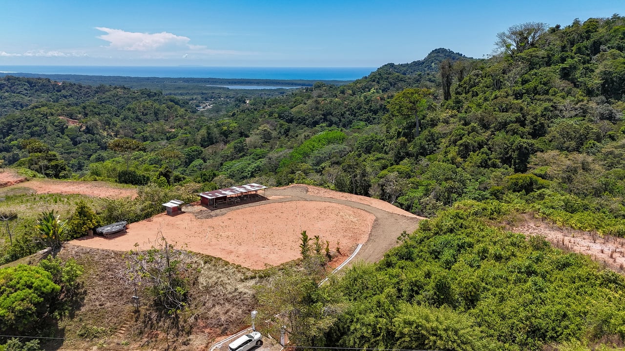 An elevated, prepared river lot with 360-degree ocean, mountain, valley and jungle views