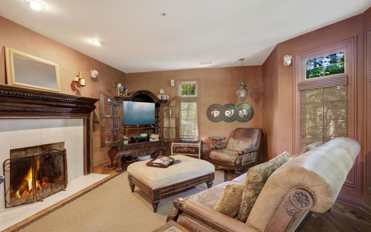 This Stately Brick Traditional Home Is Uniquely Positioned On One Of The Most Private Lots In Royal Melbourne