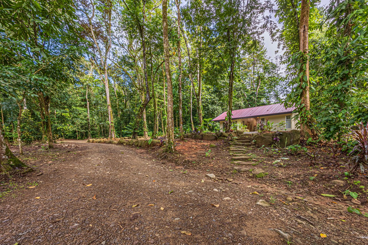 Versatile Riverfront Retreat: 5.3 Acre Rare Gem with Multiple Homes 