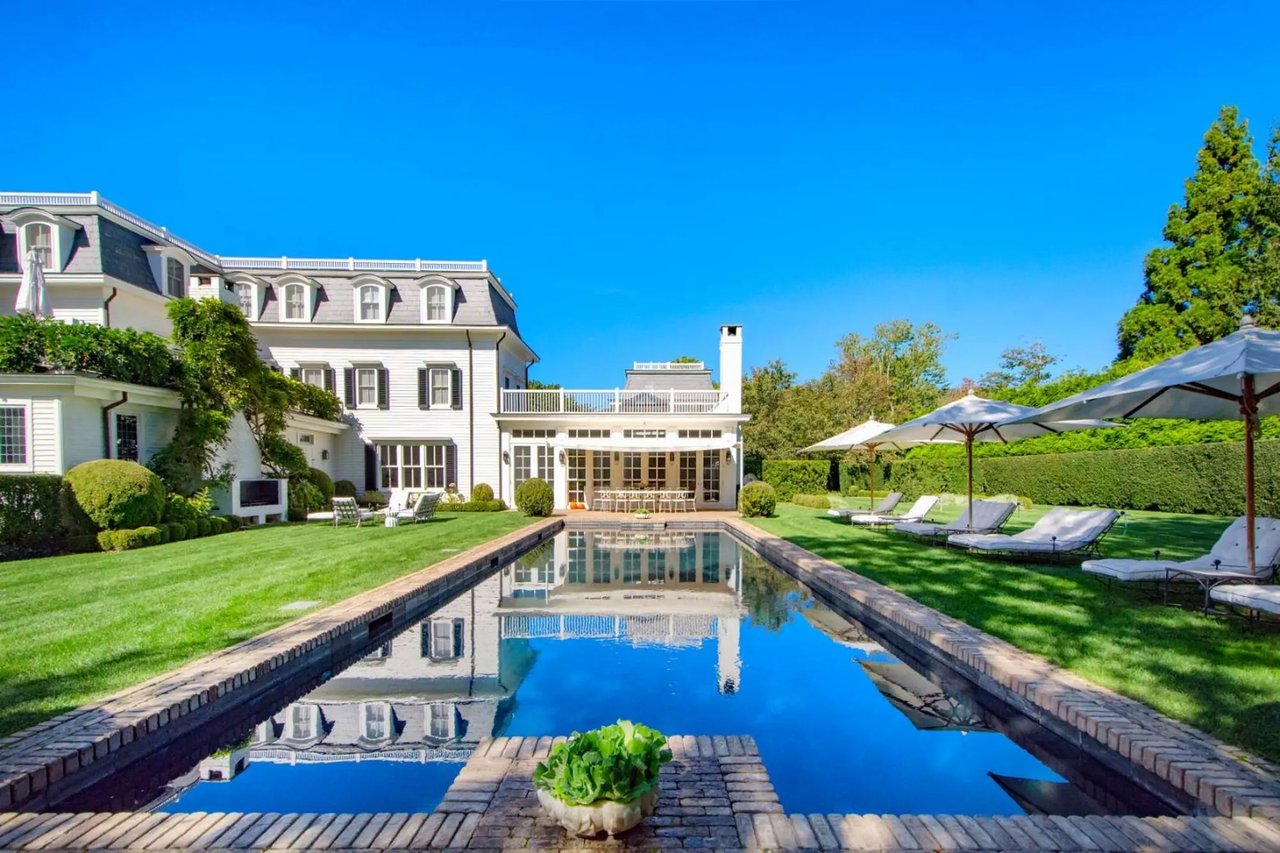 White mansion with pool