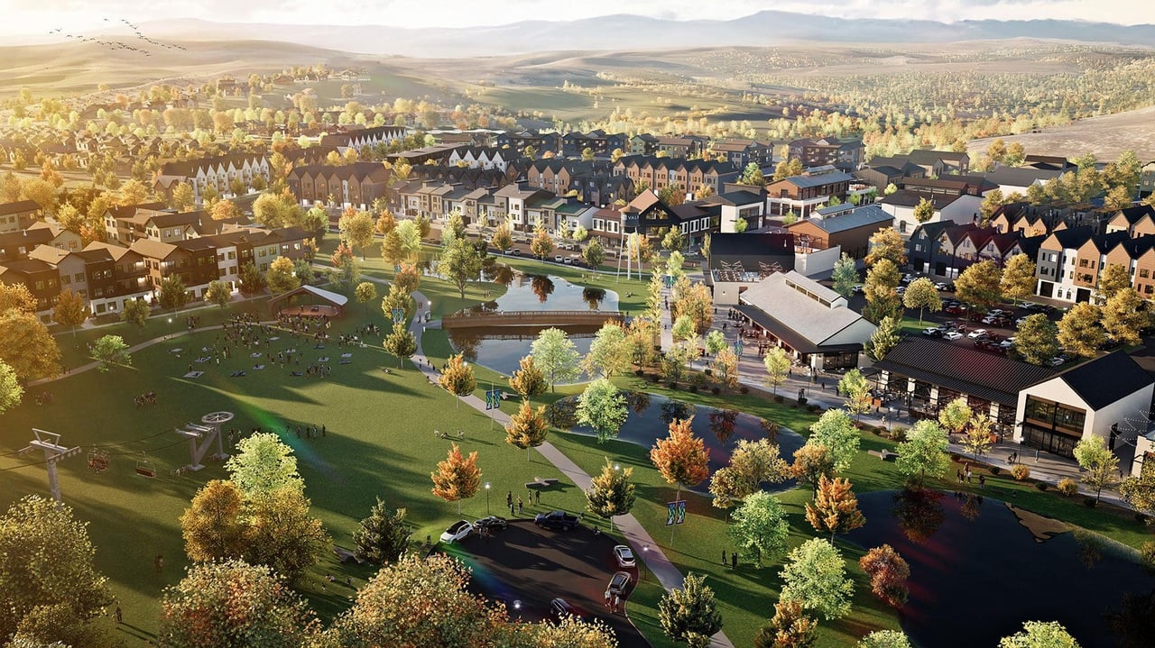 Aerial rendering of a planned neighborhood with homes, shops, a park, and a winding creek.