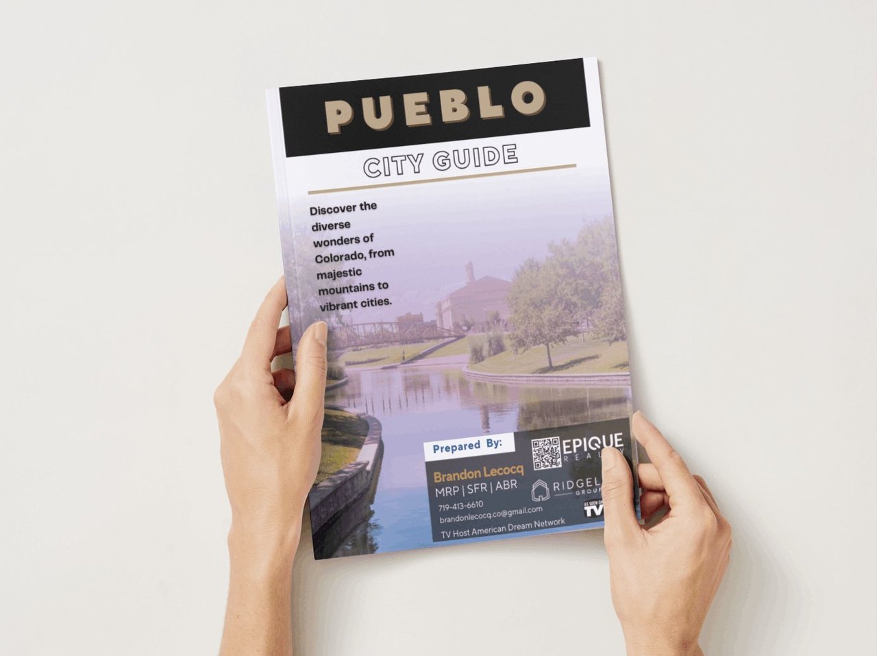 Pueblo city guide booklet cover featuring a park, waterway, and real estate agent branding.