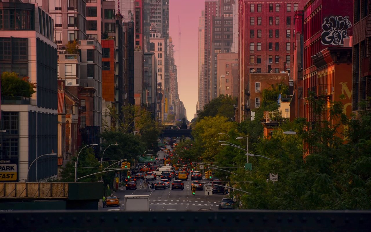 A busy city street with heavy traffic during rush hour.