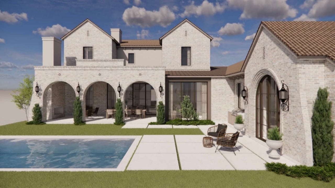 Pale-stone home with an arched patio beside a swimming pool.