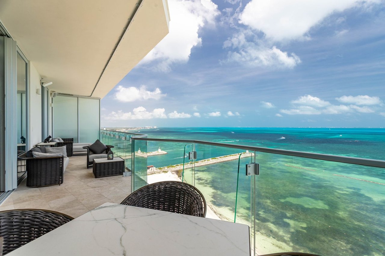 LUXURIOUS and STUNNING apartment featuring OCEAN VIEWS from the living room, primary bedroom, and terrace, with BEACHFRONT access in Cancun's most upscale area