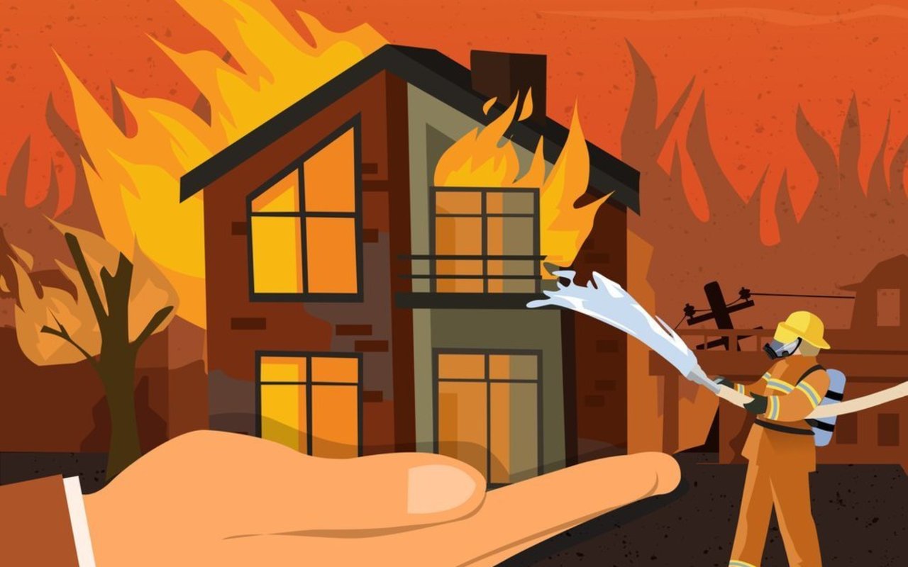 Firefighter sprays water at a burning house as a hand appears to support it.