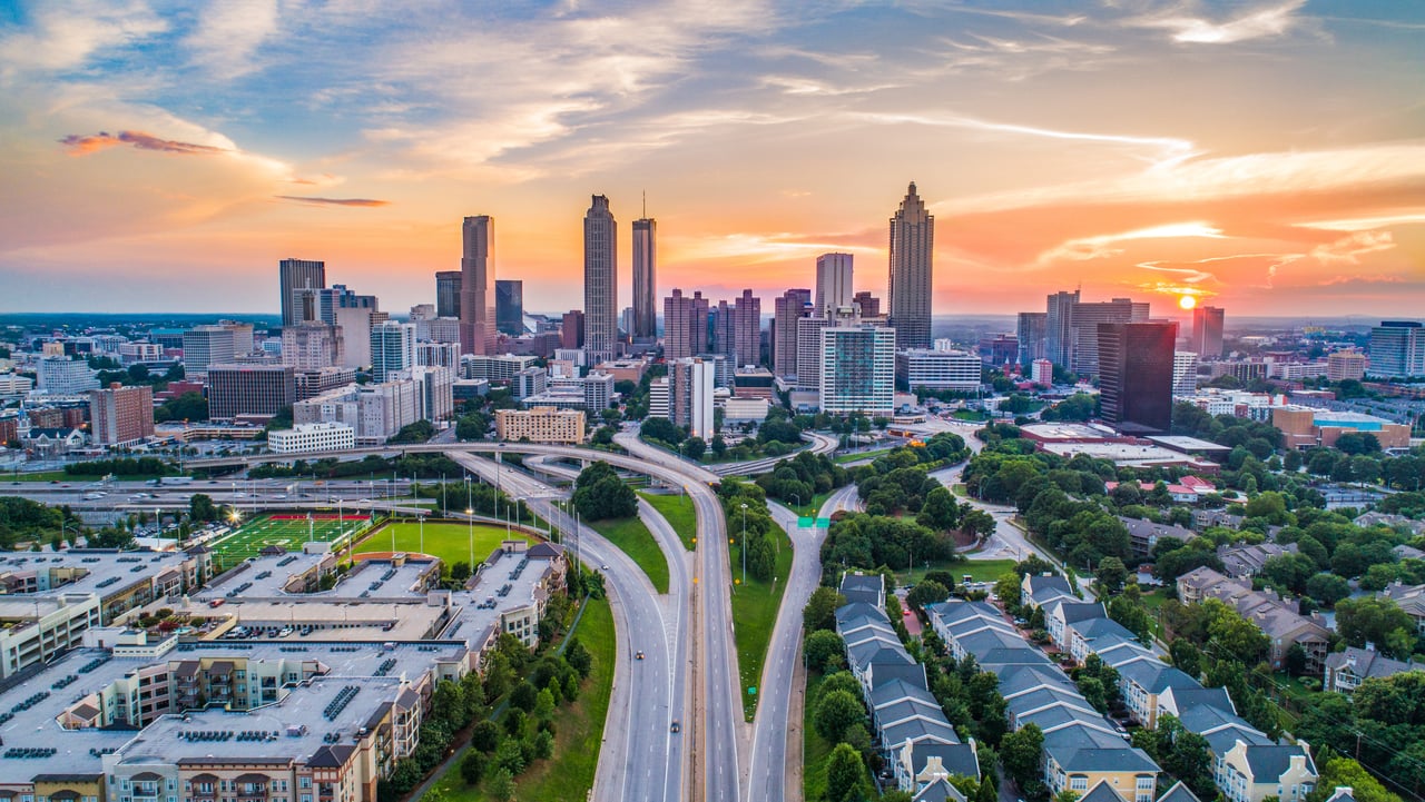 Downtown metropolitan skyline representing the urban lifestyle many homeowners exchange for the natural beauty of Franklin, North Carolina.