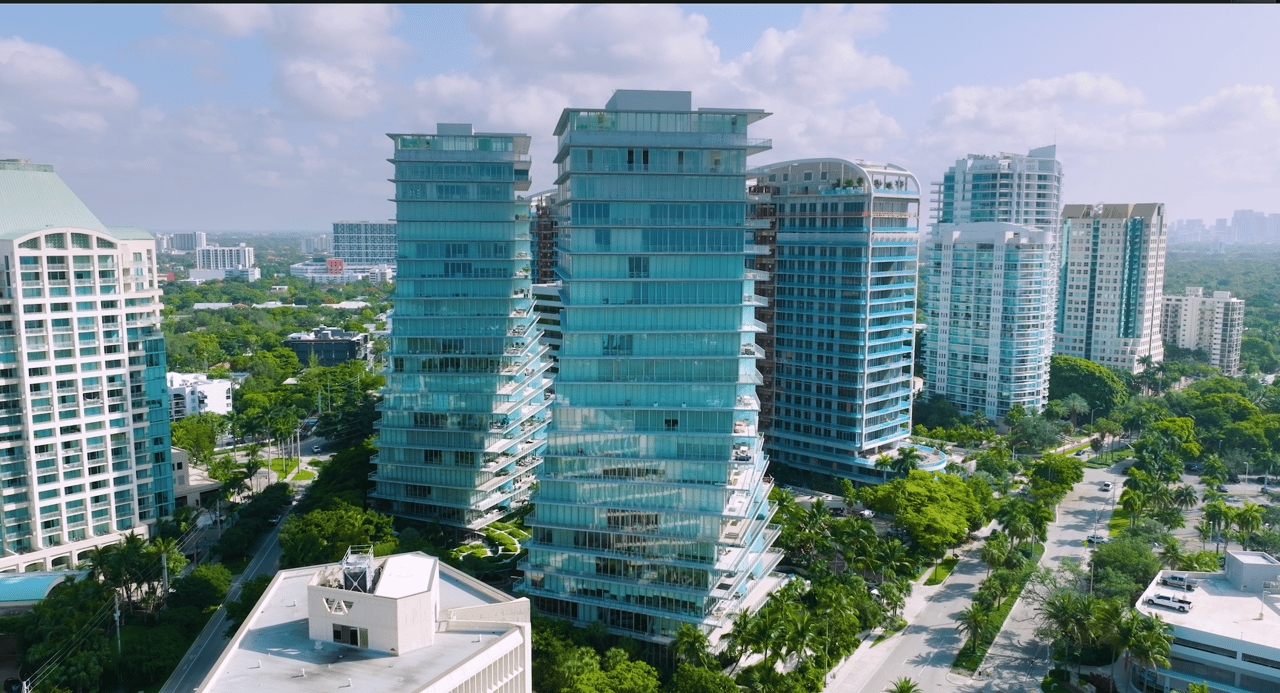 Grove at Grand Bay’s twin glass towers rise above Coconut Grove’s leafy streets.