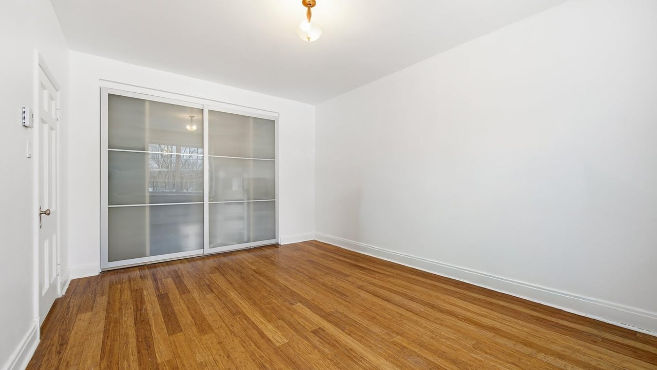 At the edge of Westmount | Corner unit with a view of Mount Royal