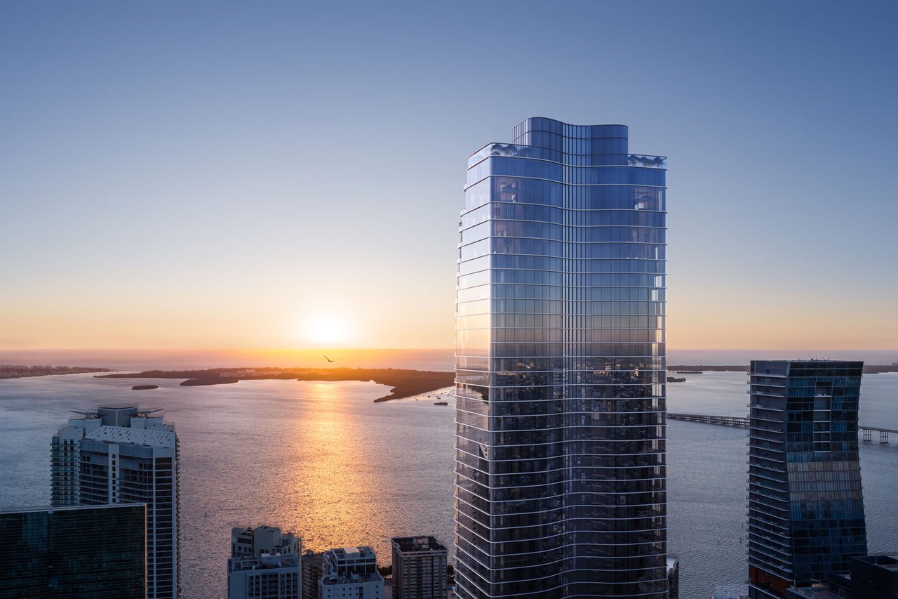 1428 Residences tower overlooking the bay at sunset, surrounded by Brickell high-rises.