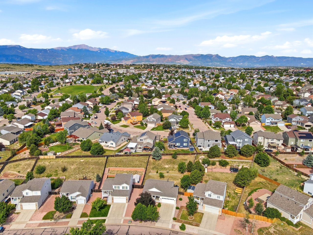Aerial View with mountain backdrop and park in background