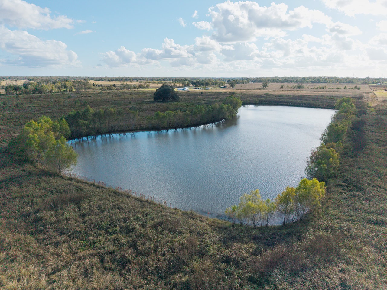 20 Acres of Land for Sale with Pond | Boling, TX | Aqua Terra Real Estate
