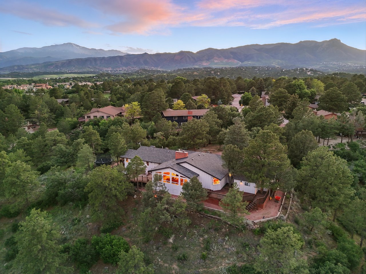 Rockrimmon neighborhood homes in northwest Colorado Springs with Pikes Peak views and mature pine trees