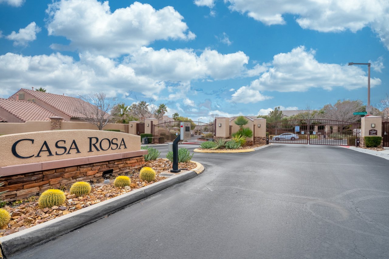 Casa Rosa community entrance with gated driveway and desert landscaping.