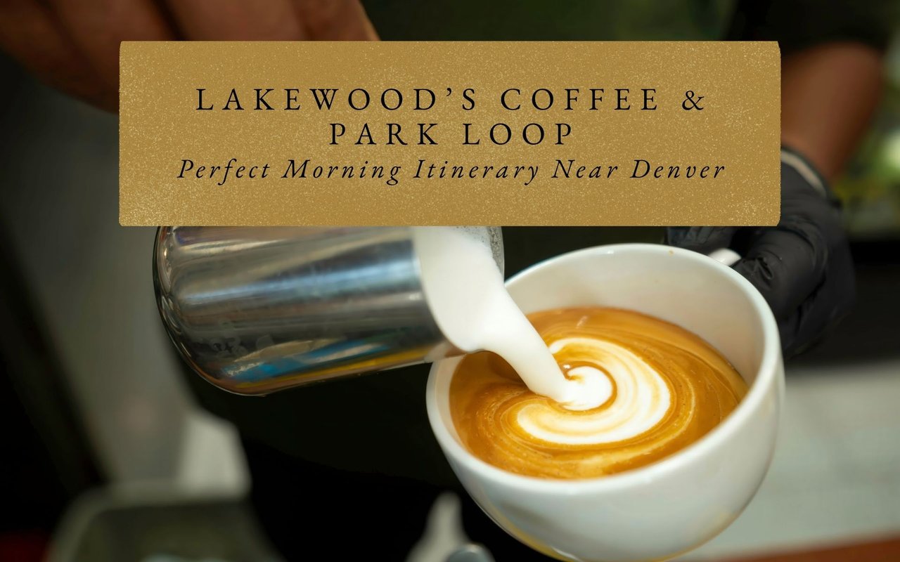 Barista pouring latte art in a cozy Lakewood, Colorado coffee shop with mountain artwork on the walls.
