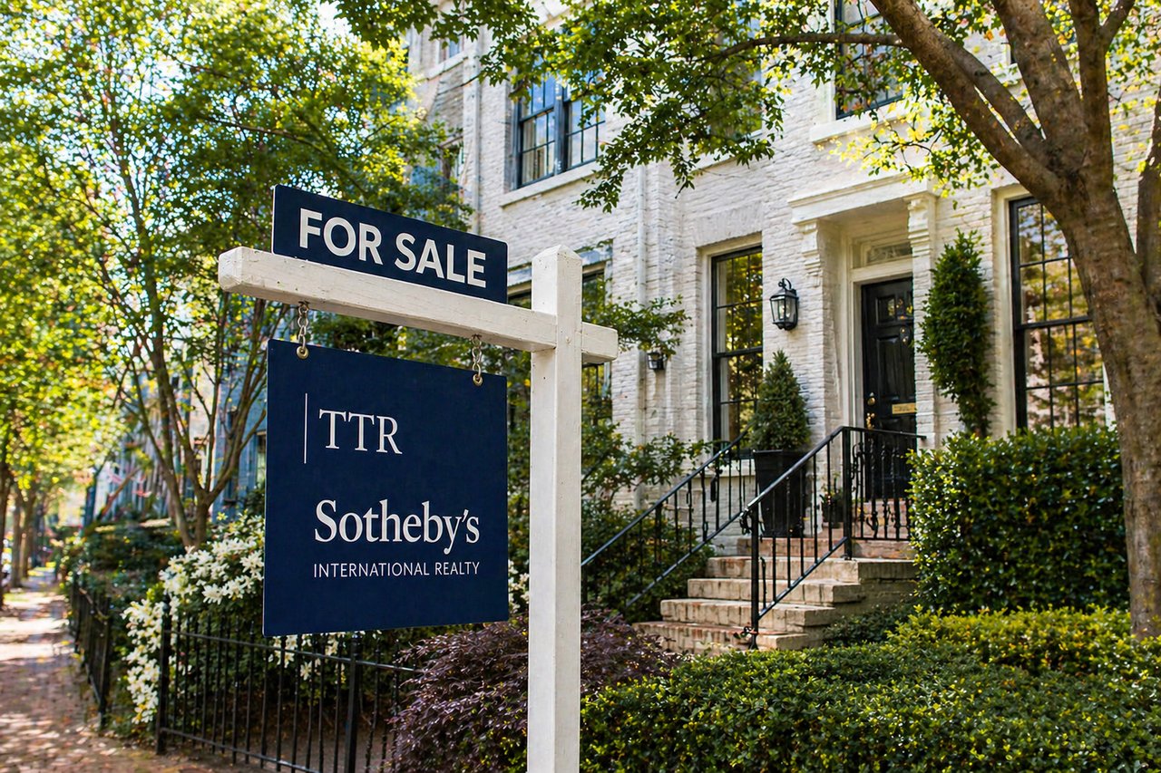 TTR Sotheby's International Realty for sale sign in front of a brick townhouse in Washington DC in spring