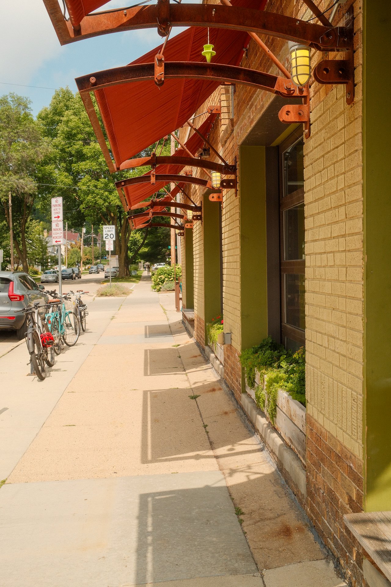 Bicycles parked along the sidewalk on Monroe Street in Madison, Wisconsin