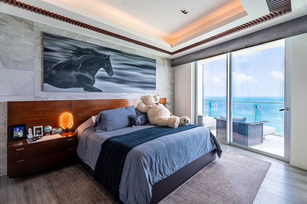 LUXURIOUS and STUNNING apartment featuring OCEAN VIEWS from the living room, primary bedroom, and terrace, with BEACHFRONT access in Cancun's most upscale area