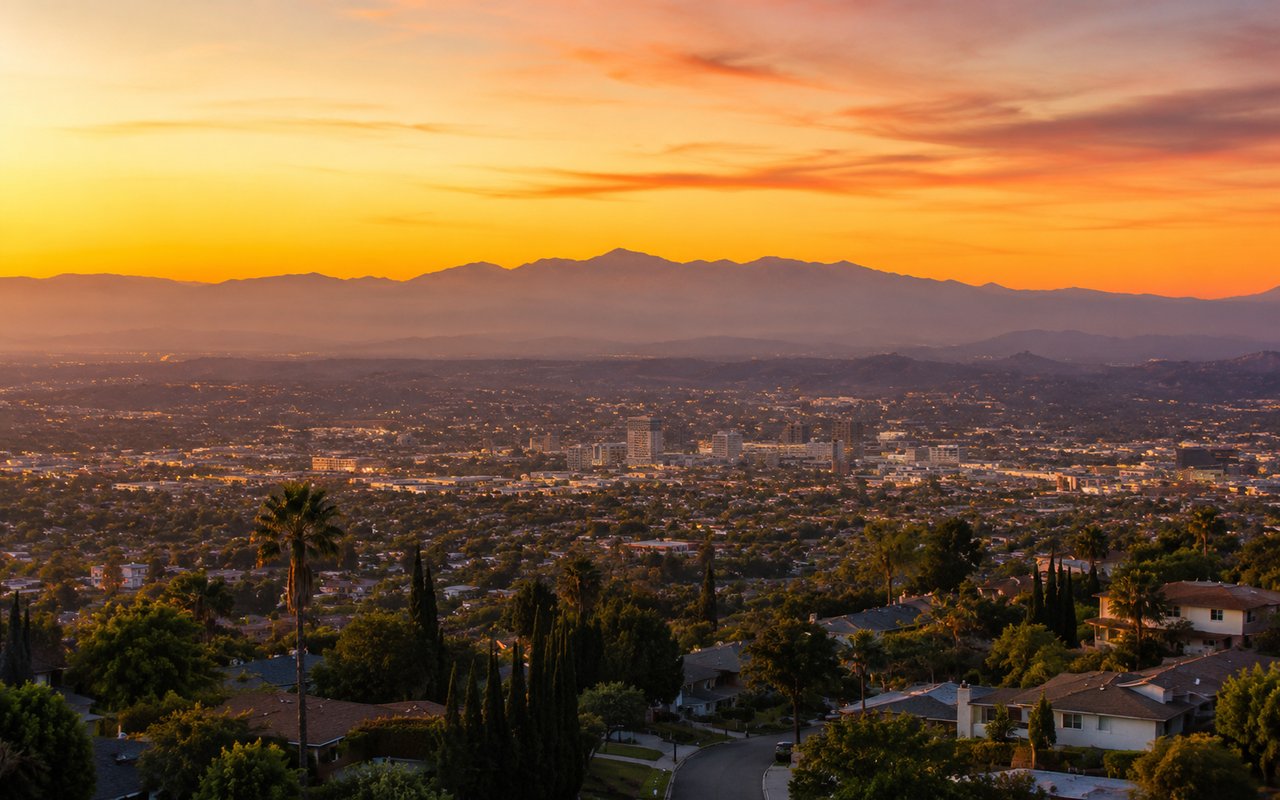 San Fernando Valley residential street with the Santa Susana Mountains in the background at sunset