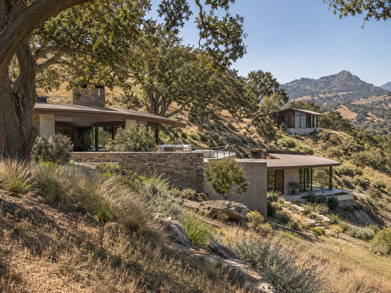 A distinctive San Luis Obispo County residence reveals its unusual architecture gradually across a layered hillside site.