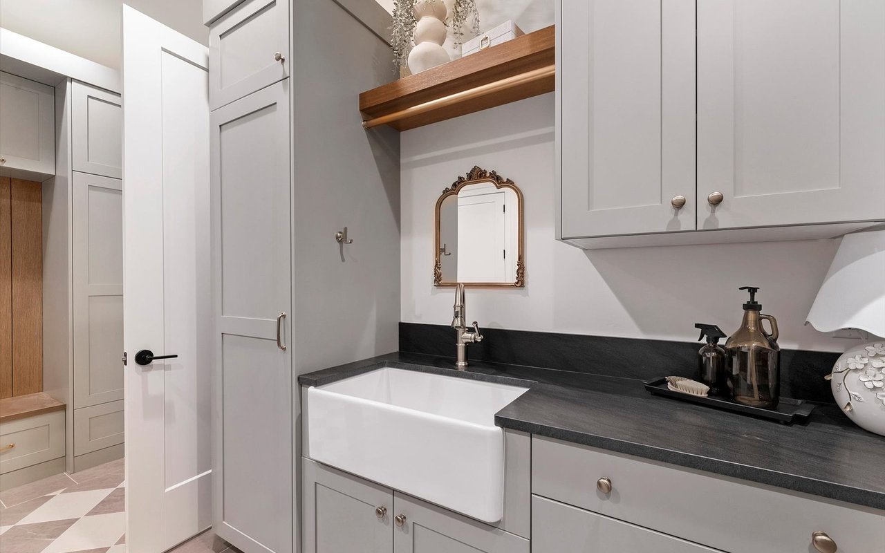 Close-up of the laundry room sink and counter, looking out towards the mudroom/drop zone