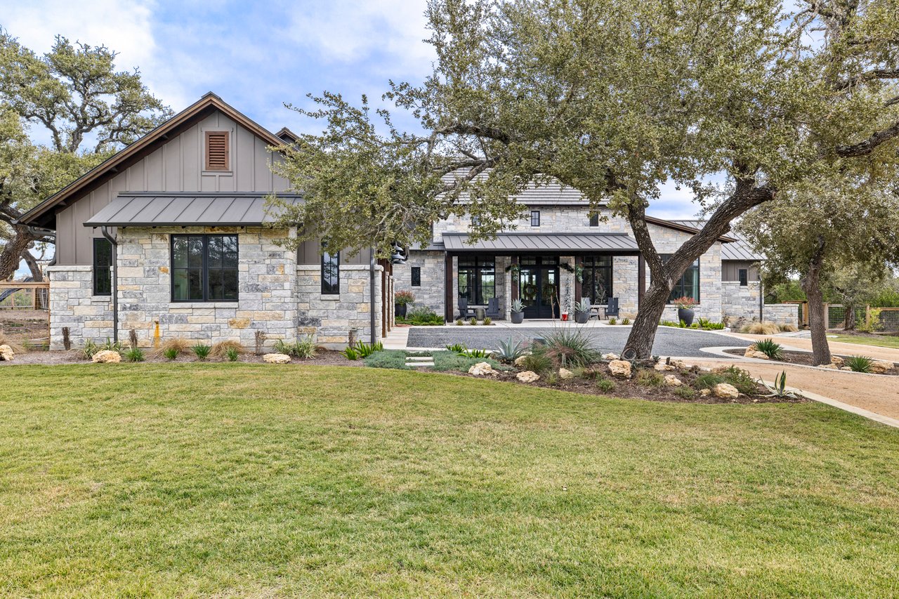 Front elevation of this Creek Road Ranch home in Dripping Springs, Texas, built by Cody Schmidt Custom Homes.