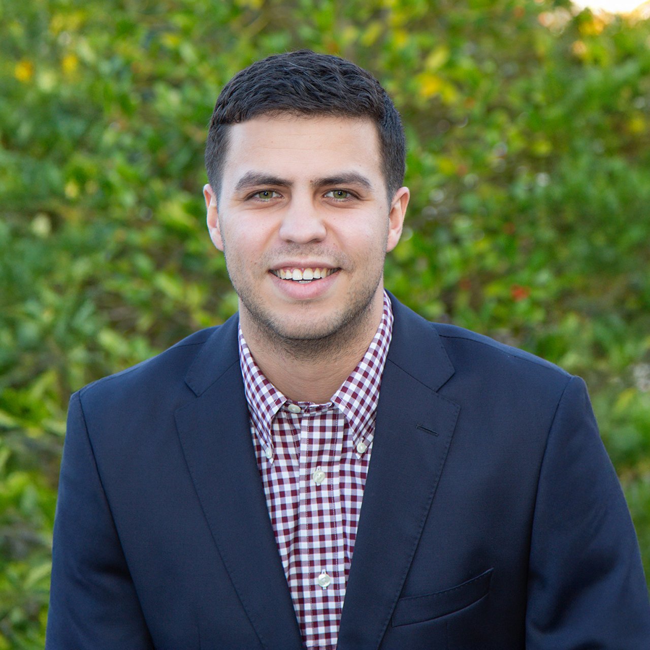 Headshot of Austin Garcia, Nashville real estate agent and U.S. Marine Corps veteran with Stormberg Group at Compass