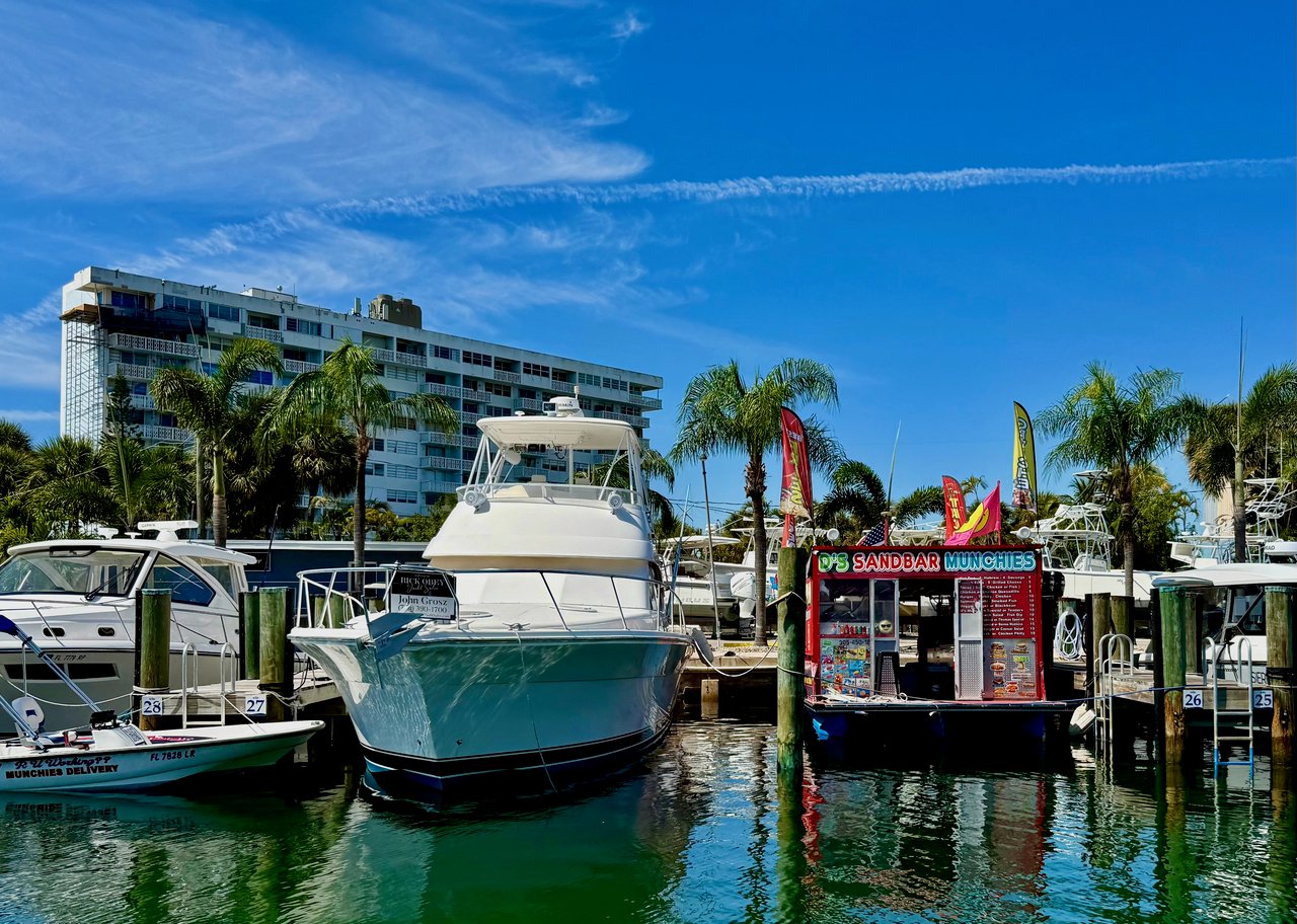Keystone Point Marina slips with docked motor yachts and center consoles in North Miami
