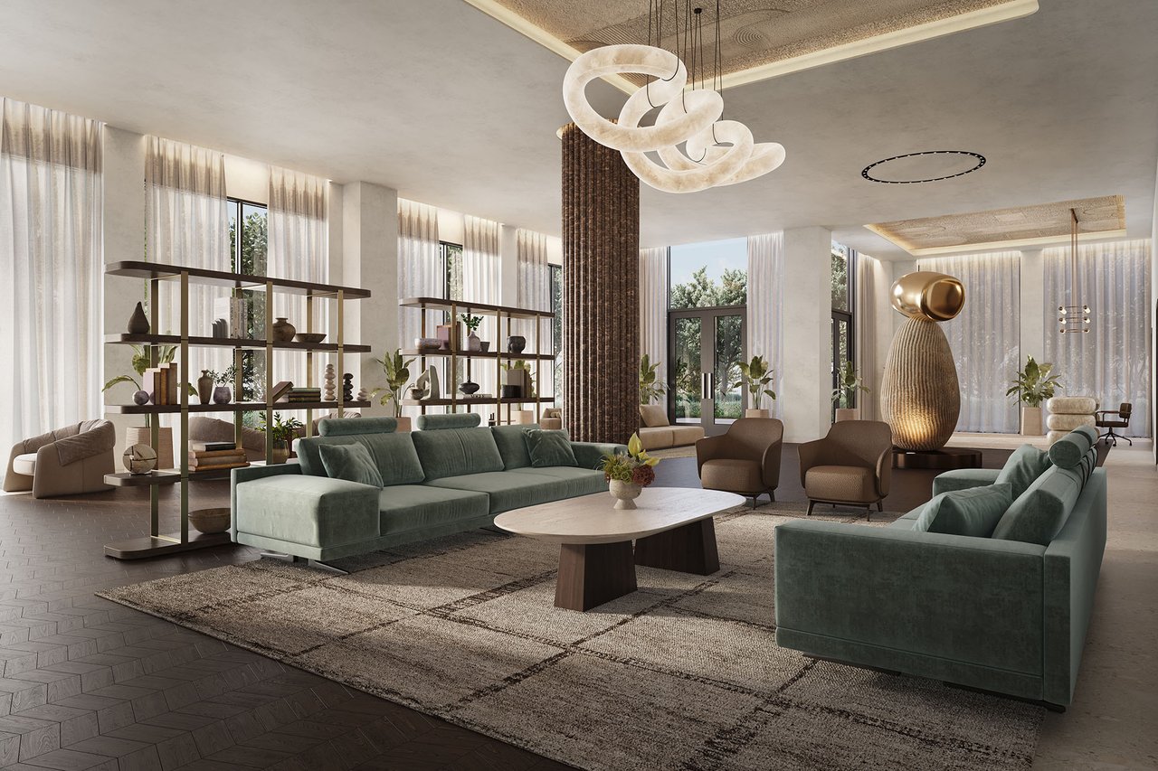 Luxury condo lounge with green sofas, sculptural pendant lighting, and tall windows overlooking greenery.