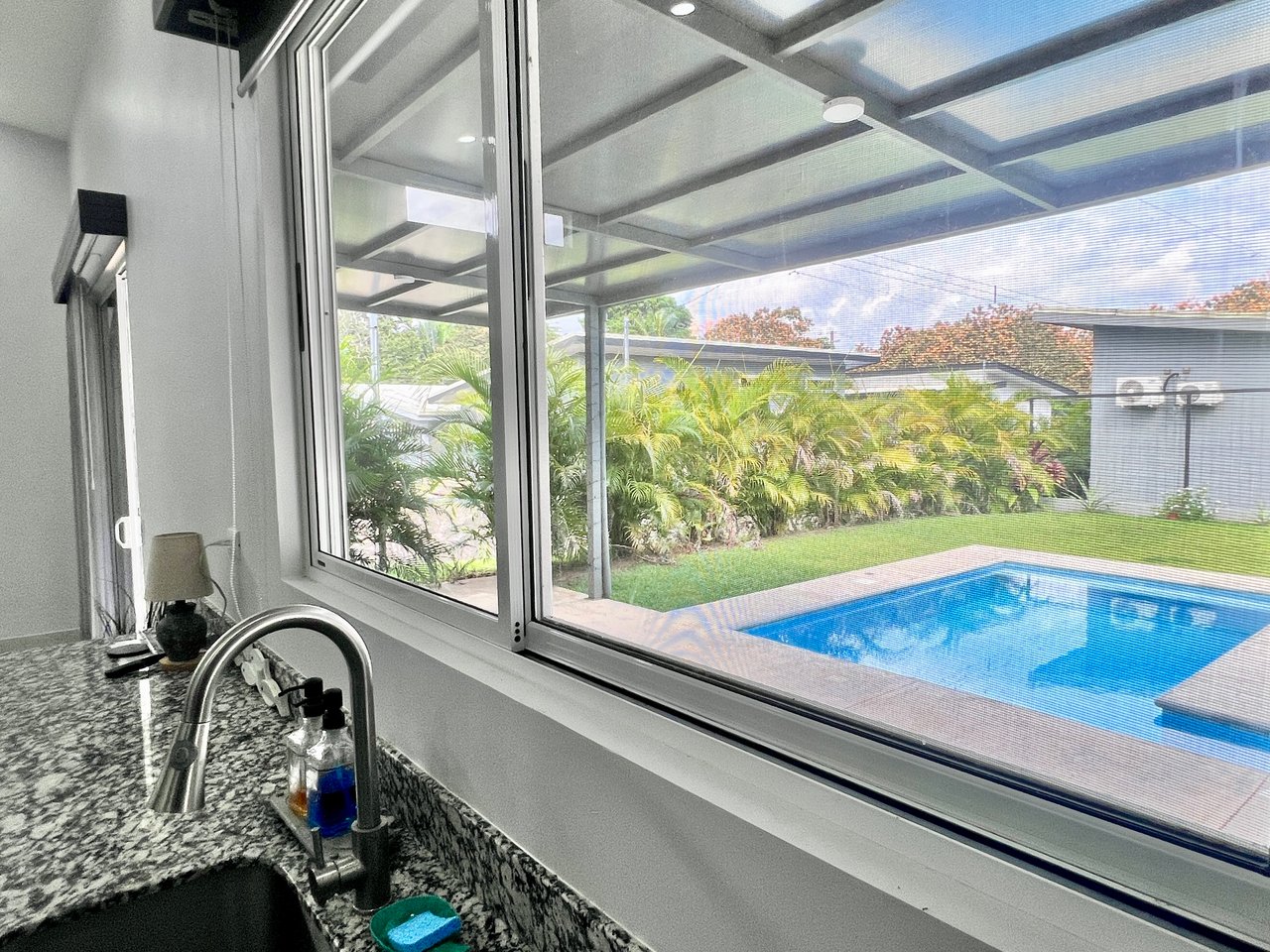 Quepos Hills Villa with pool and covered patio and tropical gardens