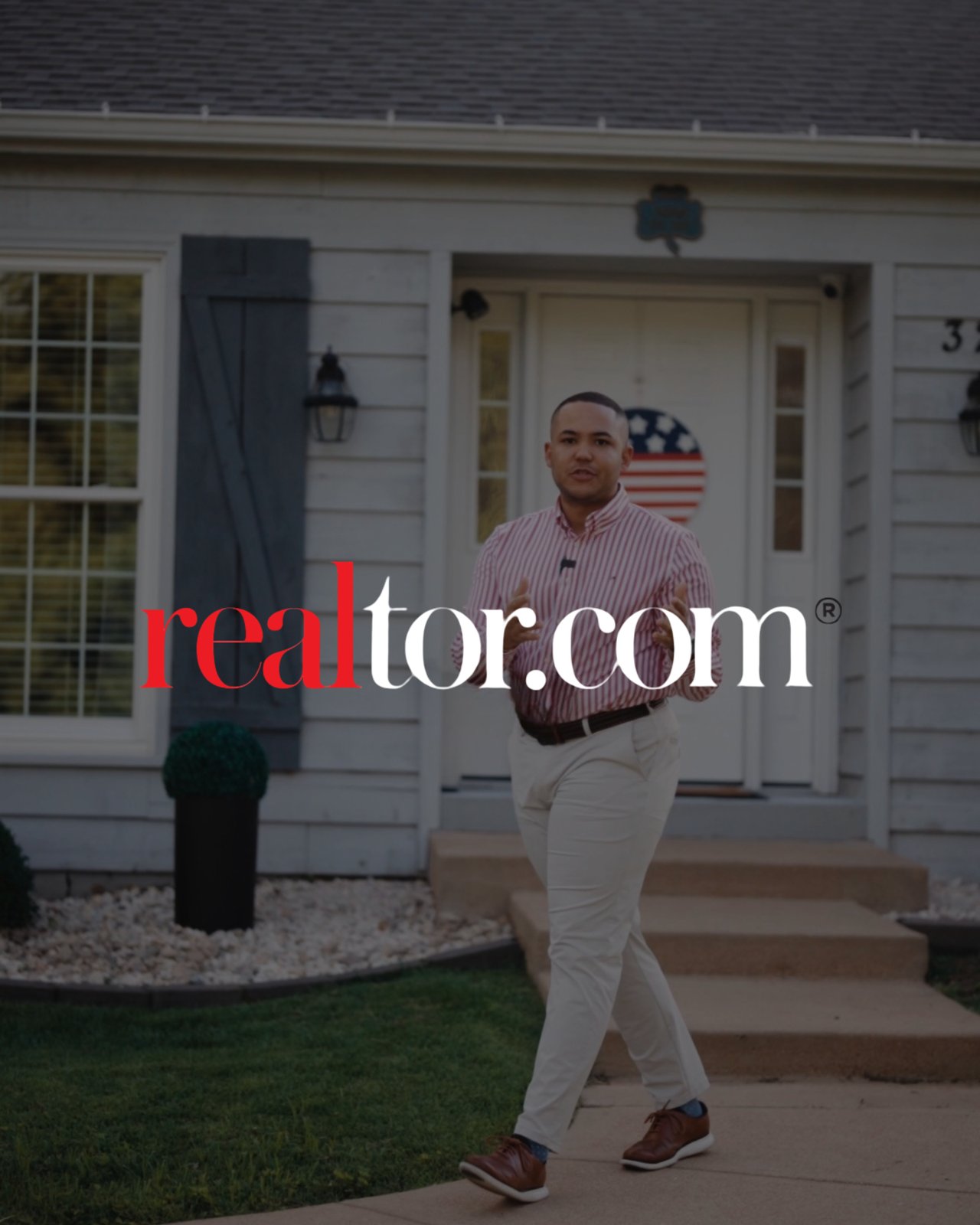 Man in a striped shirt walking in front of a house, with a realtor.com logo overlay.