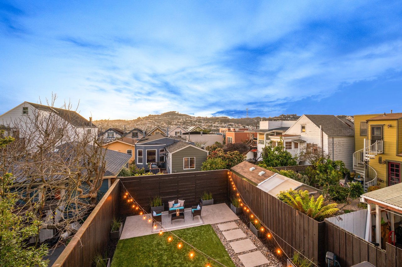 Homebuyer sitting with real estate agent reviewing offer paperwork before making an offer on a San Francisco home