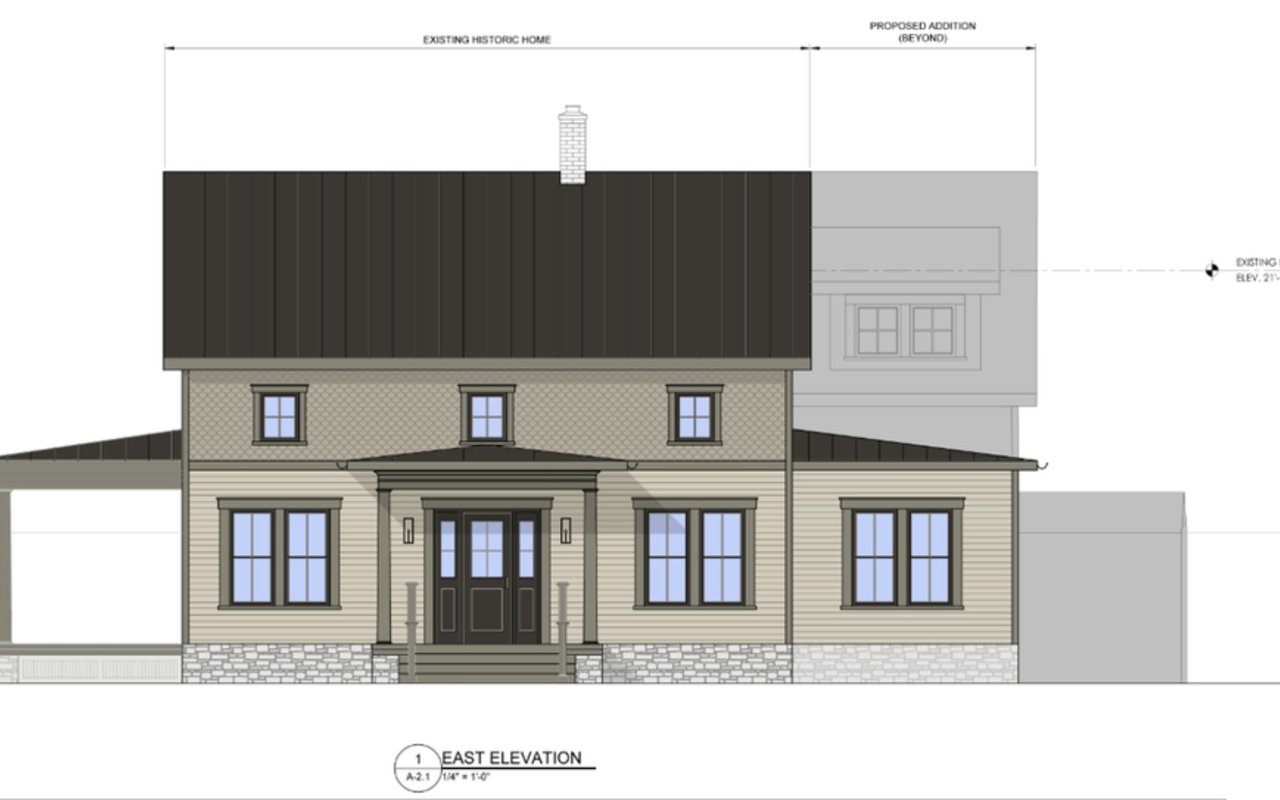 East elevation drawing of a historic home renovation with a centered entry porch and proposed addition beyond.