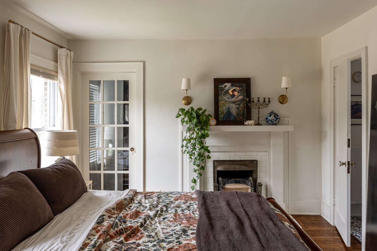 primary bedroom with fireplace in gatewood historic
