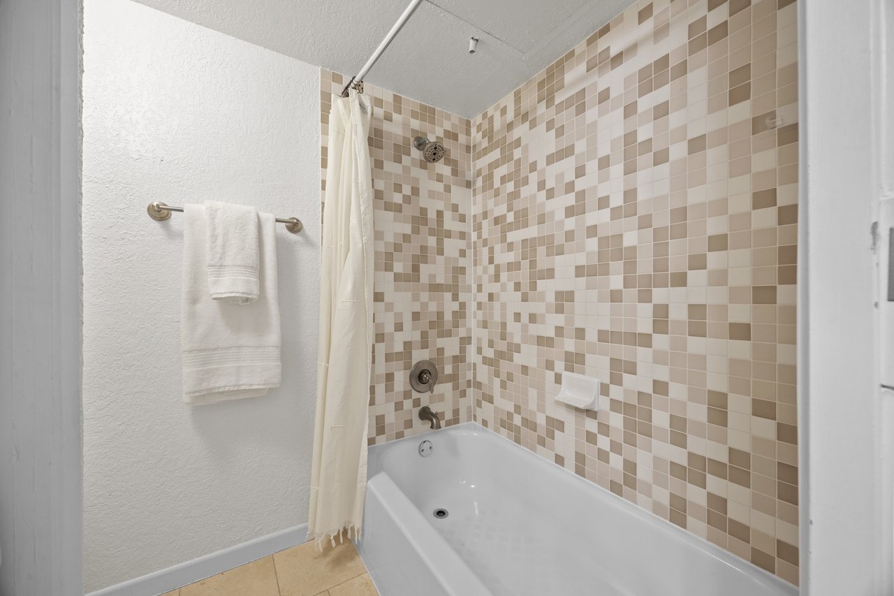 Top-Floor Condo Retreat in Gated Ivy Condos | Private Balcony + Tree-Filled Views