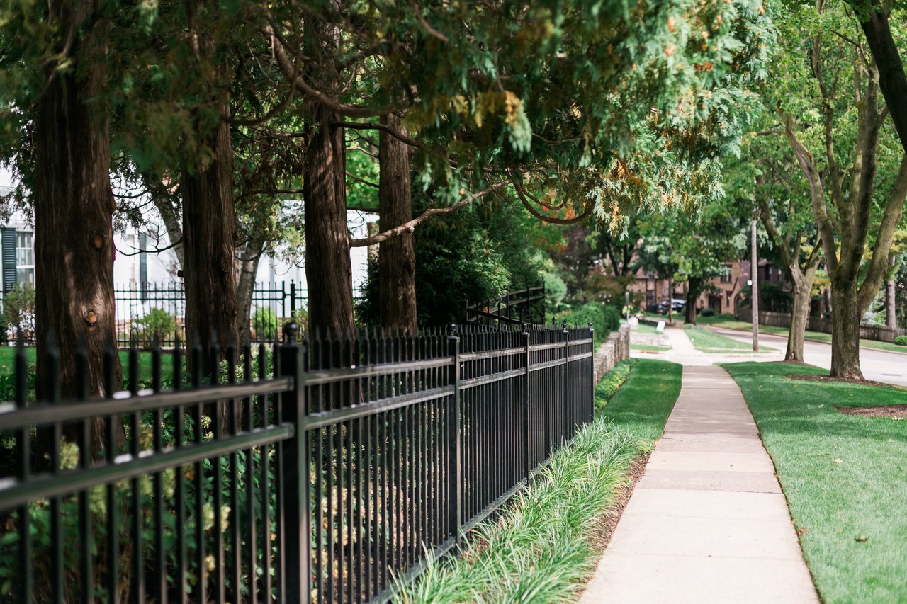 A tree-lined residential street in Madison’s Nakoma neighborhood, where Cait Berry helped returning clients purchase their dream home sooner than expected.