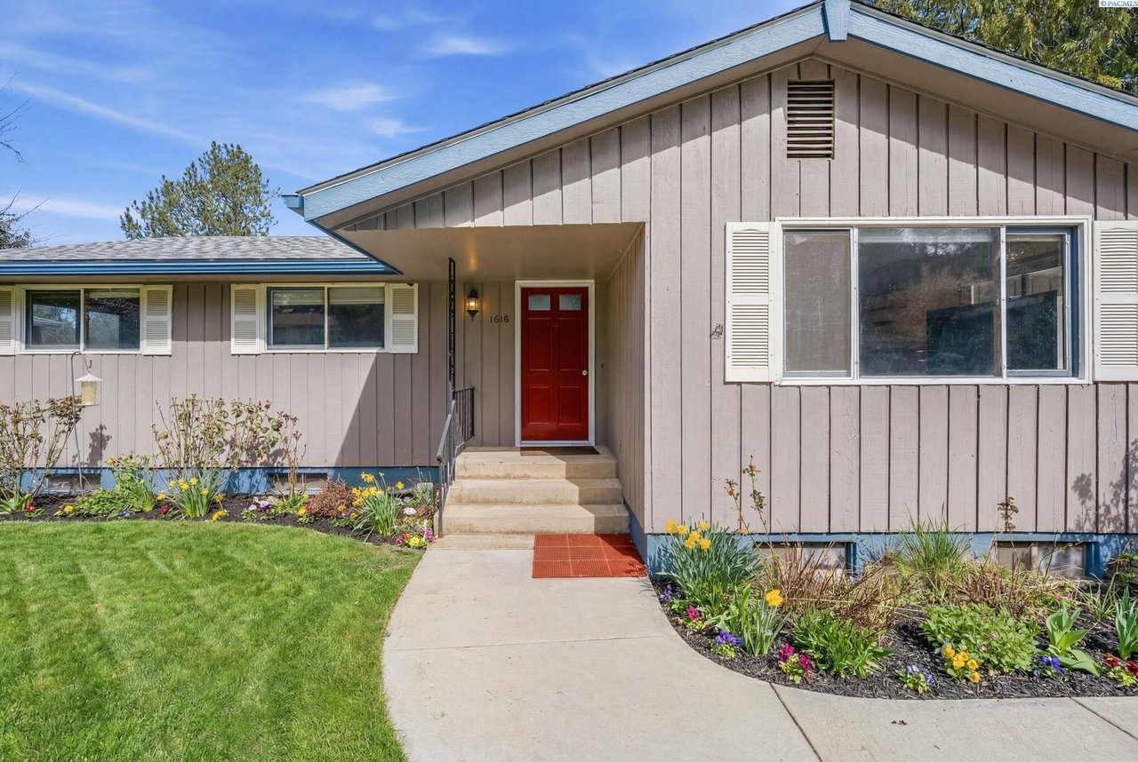 Home at 1810 NW Deane Street in Pullman WA featuring 5 bedrooms, 2 kitchens, a large deck, and a garden-ready yard on Military Hill.