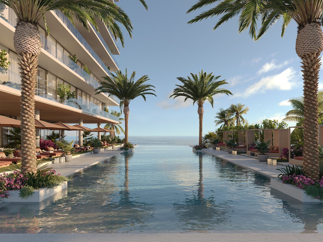 Oceanfront residence with an infinity pool, palm trees, and furnished poolside terraces.