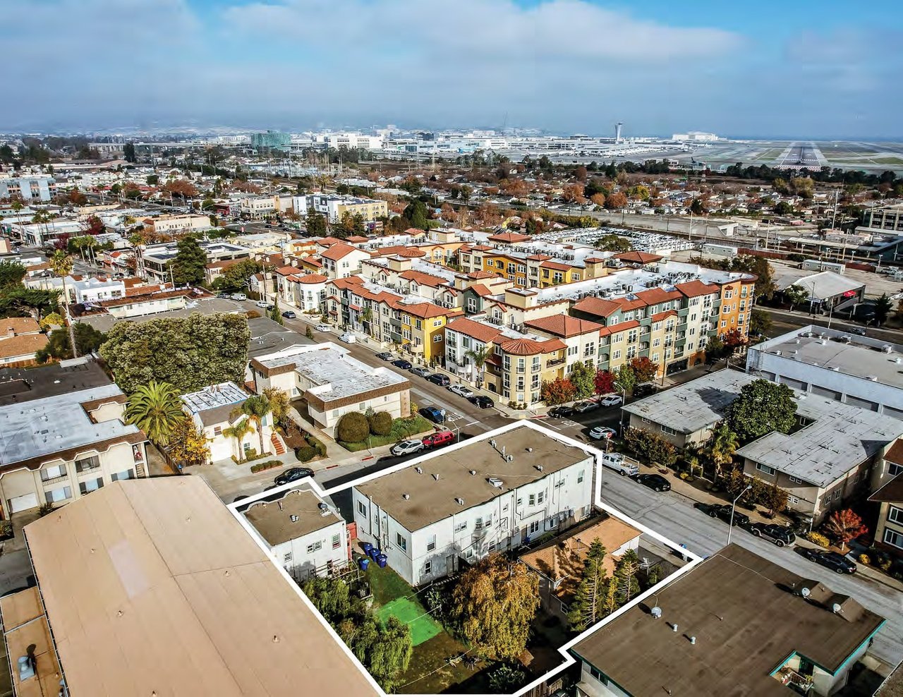 Aerial of 75 Broadway and 105 Chadbourne Avenue in Millbrae with SFO in the background
