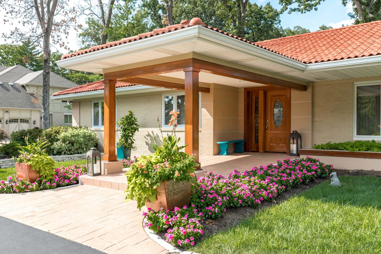 A Special Retreat on a Prized One Acre Lot With Pool and Tennis Court