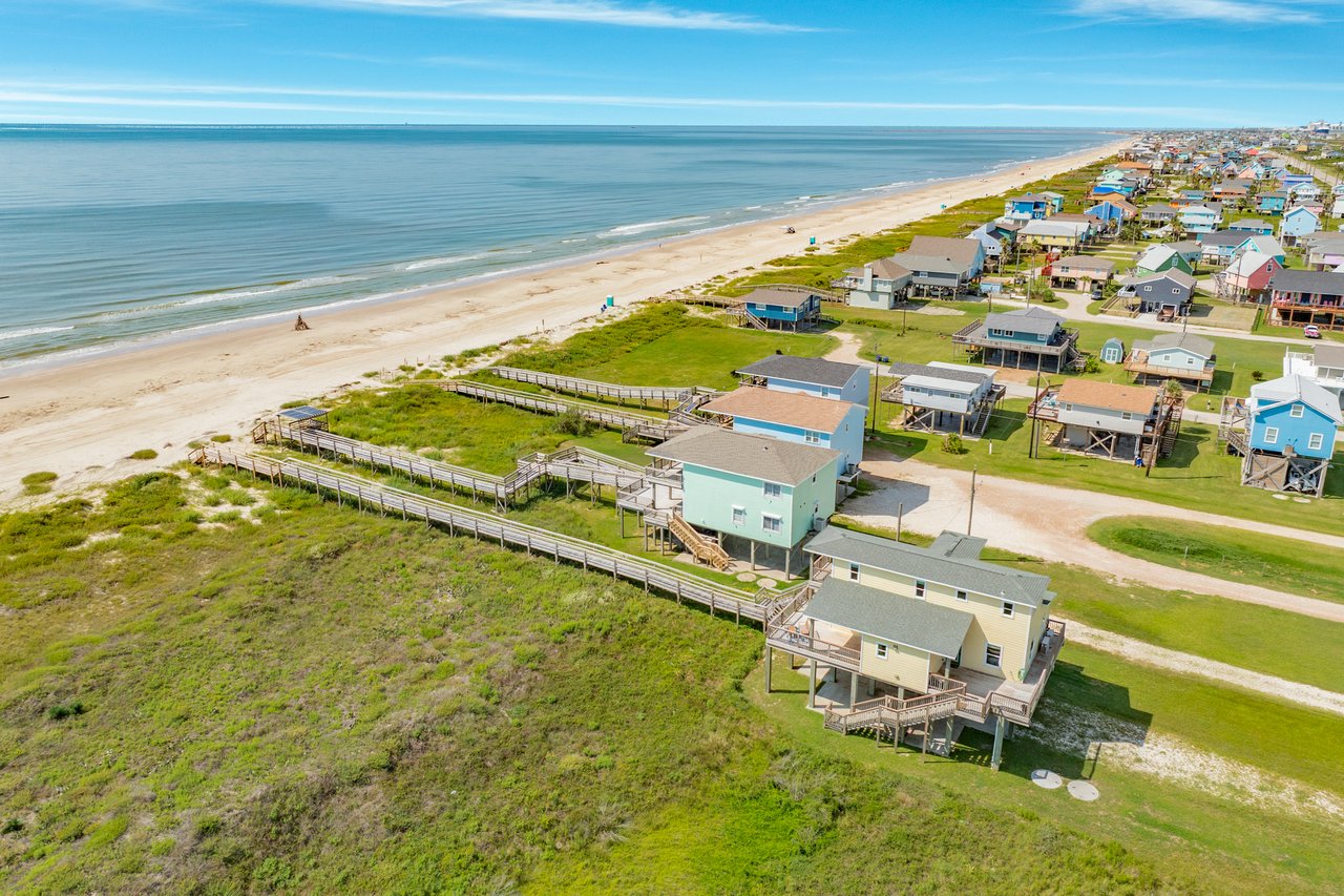 Gorgeous blue waters and white beach front sand on the Gulf of America and images of raised homes for sale in Surfside Beach Texas