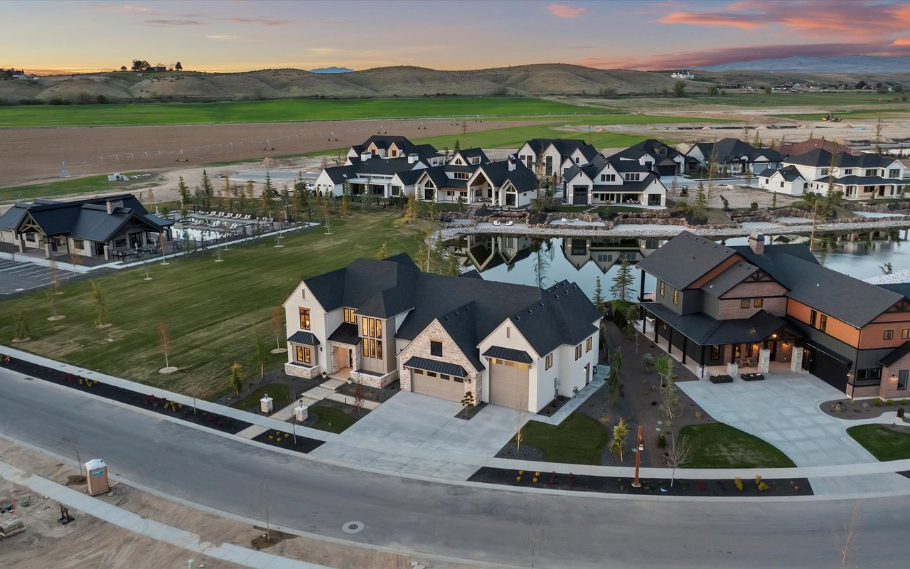 North-facing aerial view of Frost Homes' Rockhaven Dr traditional home with foothills in the background
