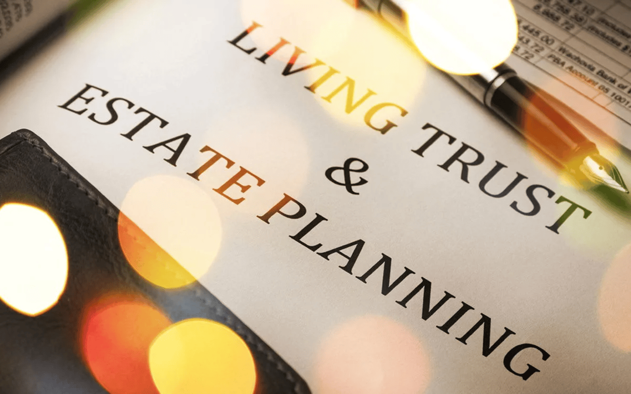 Estate planning document titled “Living Trust & Estate Planning” beside a fountain pen.