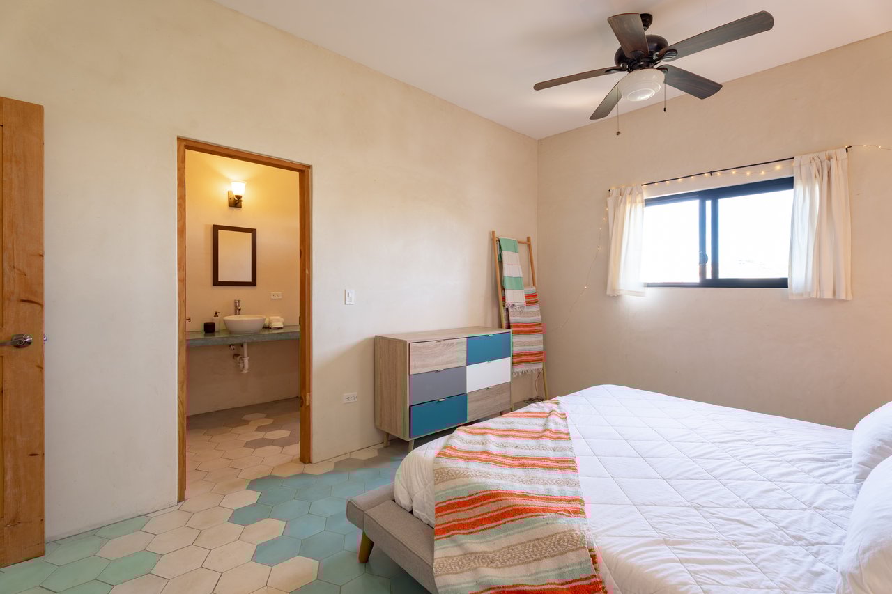 Primary bedroom with en suite bathroom at The Studio House in Villas de Cerritos in Cerritos, Baja California Sur.