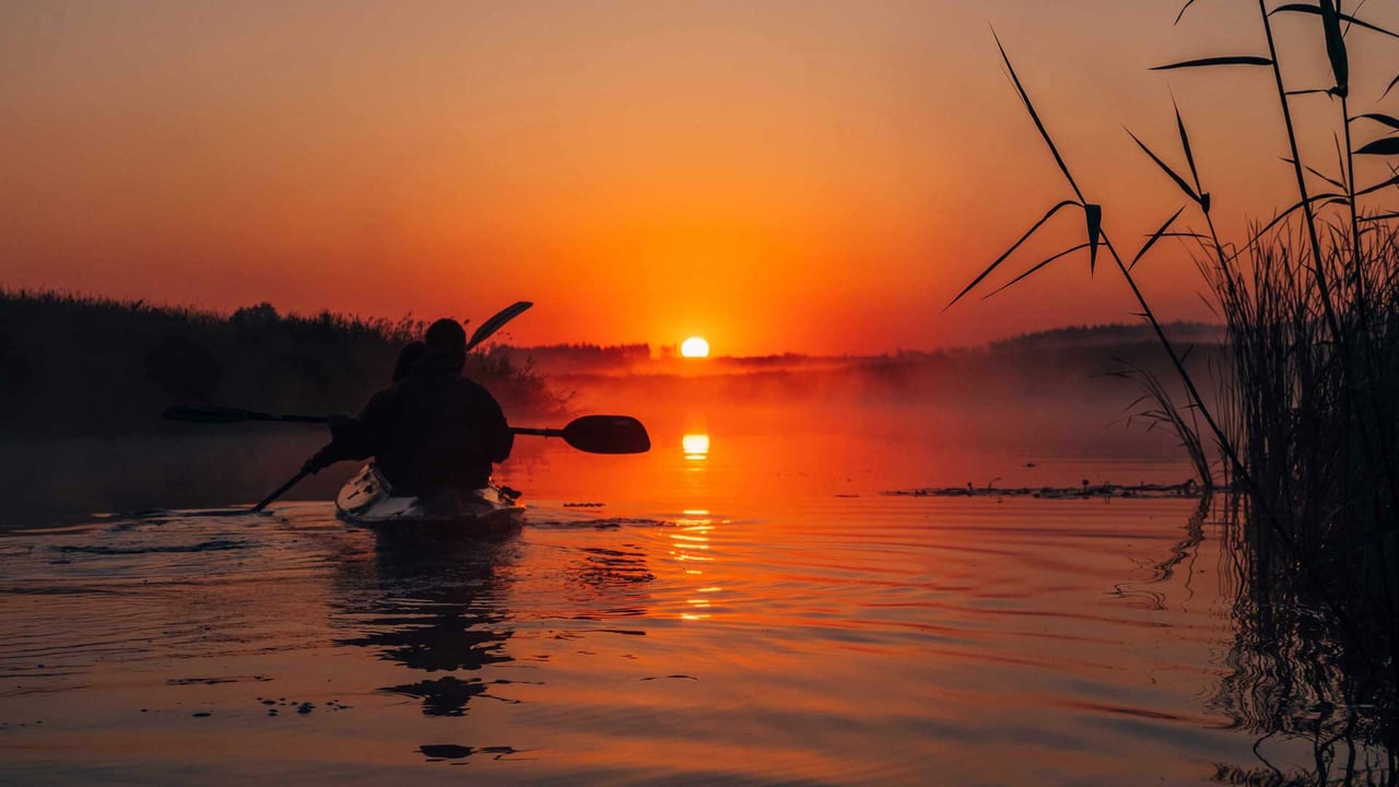 Kayakers paddling at sunset on Johns Island, South Carolina