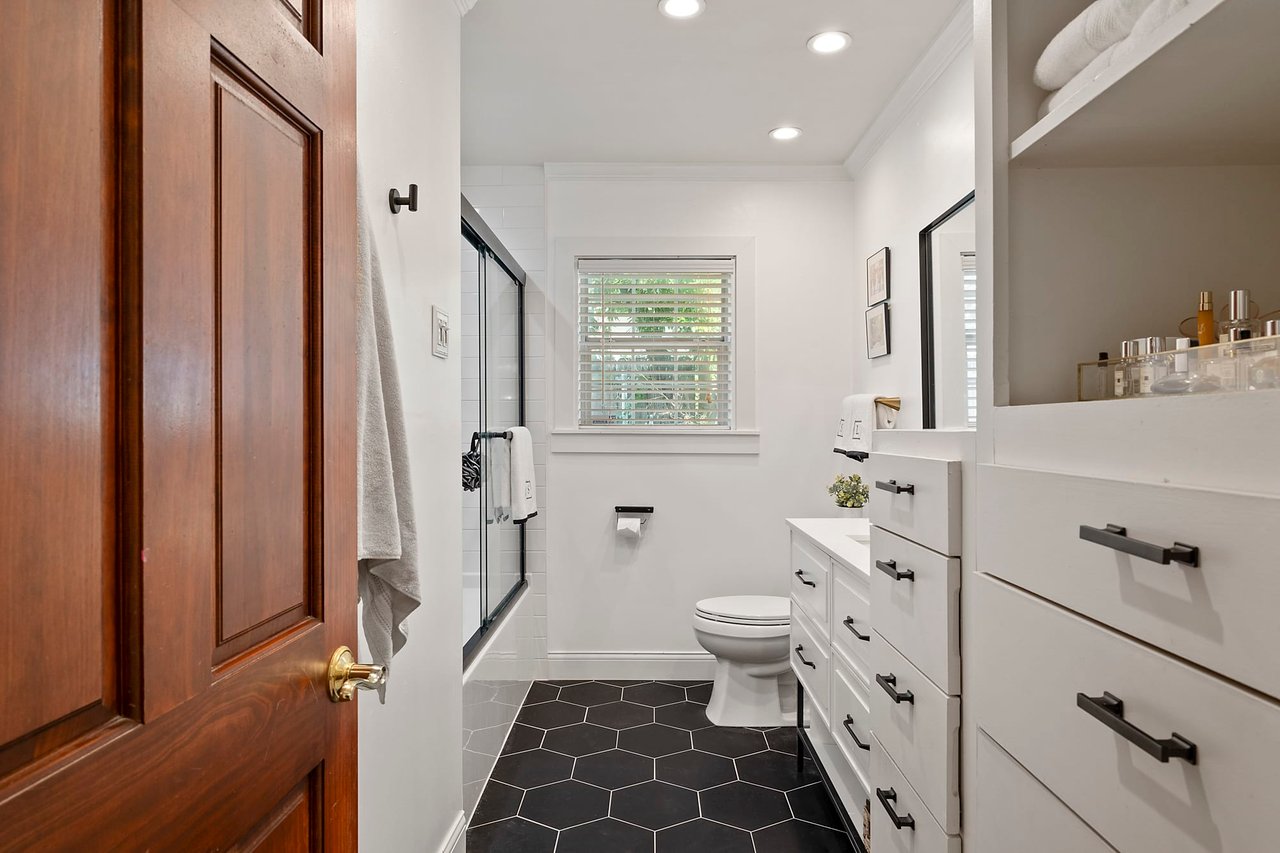 Primary bathroom with black hexagon tile flooring, Tarrytown, Austin.